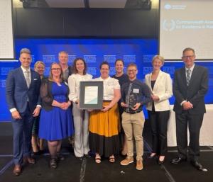 Image of a group holding a certificate, including; Christopher McDermott, Liz Brayshaw, Melissa Mills, David Whitfield, Adriana Wlodarczyk, Deanne Allan, Lucinda Atkinson, Jac Sera, Shelley Hudolin, Simon Newnham.